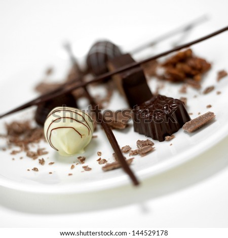 chocolate pralines, white,black chocolate on plate