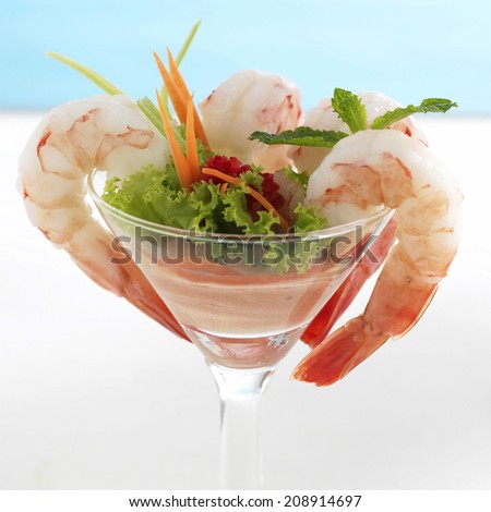 Shrimp or Prawn Cocktail. Isolated on a White Background. Healthy Shrimp Salad with mixed greens and tomatoes. Diet. Shrimps