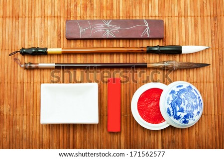 the Chinese set for calligraphy, the art of calligraphy, brush for Chinese painting, bamboo brush, Chinese ink, goods for calligraphy