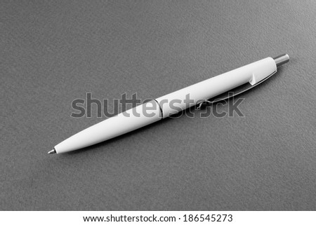 white pen on a gray background
