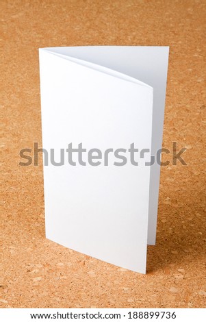 Blank folding one page booklet on corkboard background, identity design, corporate templates, company style