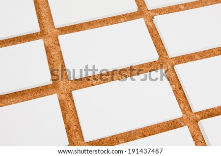 identity design, corporate templates, company style, blank business cards on corkboard background
