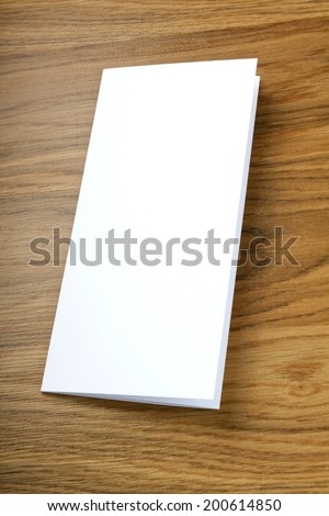 blank white folding paper flyer on a wooden background, identity design, corporate templates, company style