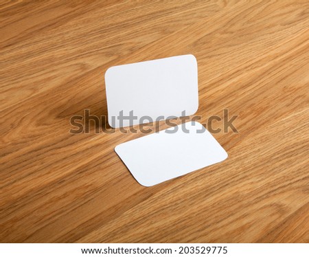 identity design, corporate templates, company style, blank business cards with rounded corners on a wooden background