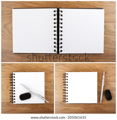 Open notebook with white page. Open empty notebook with pen and eraser on a wooden background