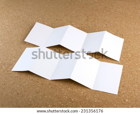 identity design, corporate templates, company style, set of booklets, blank white folding paper flyer on a cork background