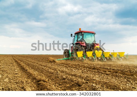 Farmer seeding crops at field