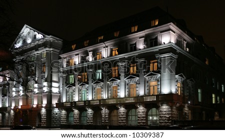 Lighting facade of government building at evening and its windows different color of light.