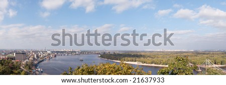 Panorama of Kyiv from right side of river Dnipro. From left to right: oldest district of Kyiv - the Podol, Moscow and Railway bridges, construction of new bridge, Troeschyna district, Walking bridge