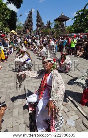 UBUD, BALI, INDONESIA - NOVEMBER 1: Traditional poleng dancers at cremation of the Queen ceremony on November 1, 2013 in Ubud, Bali. Ngaben is traditional ceremony of cremation in Bali.