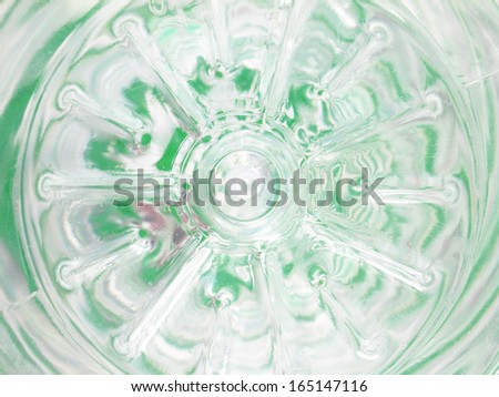 The bottom of empty plastic water container with recycle sign closeup