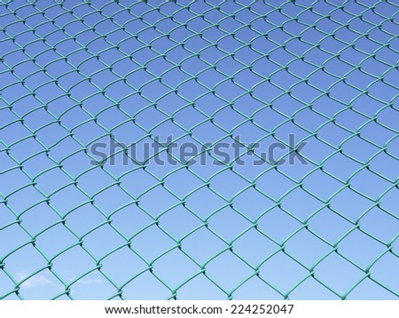 Green seamless fence chain, Iron wire fence on blue sky background