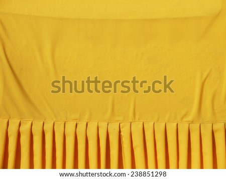 crumpled yellow monk robe. Background