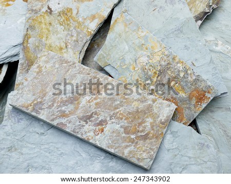 Close up gray stone tiles on stack