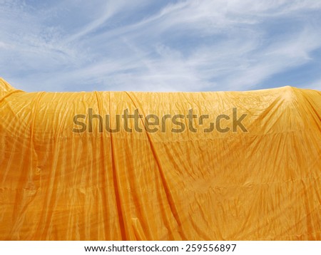 crumpled yellow monk robe