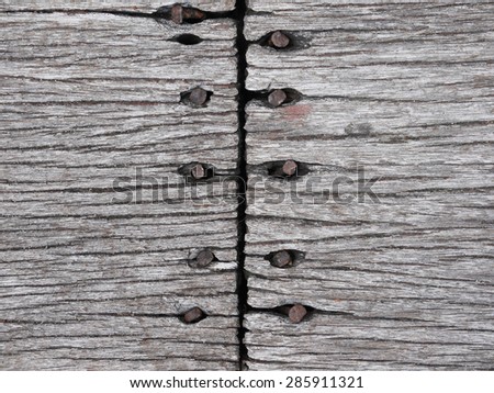Old wooden board with nails texture