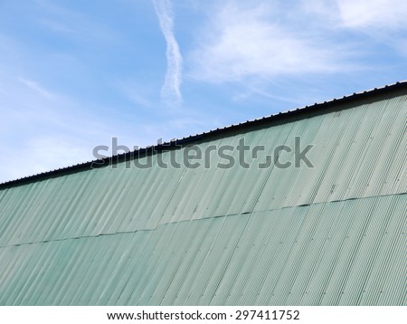 green zinc roof with blue sky