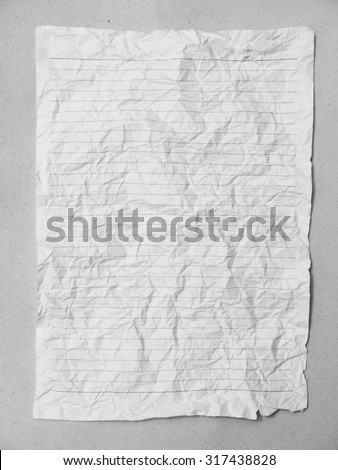 Crumpled sheet of lined paper or notebook paper