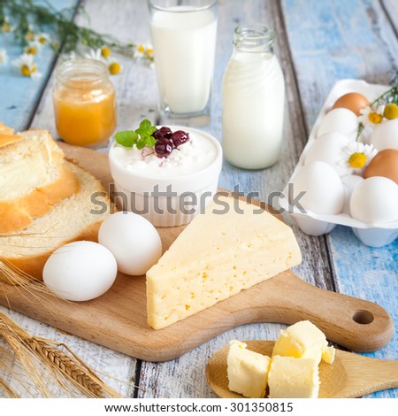 Dairy products: milk, beaded cottage cheese, butter, yogurt, cheese. With bread, honey and fresh eggs