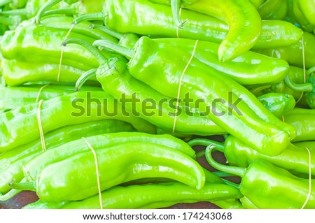 groups of green paprika hold together with rubber band