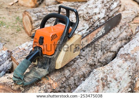 Carpenter tools Timber cutting wood with old saw, chainsaw and blade