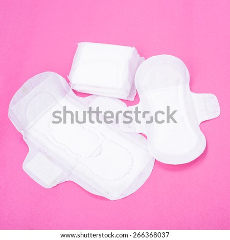 Woman hygiene protection (sanitary) on paper background