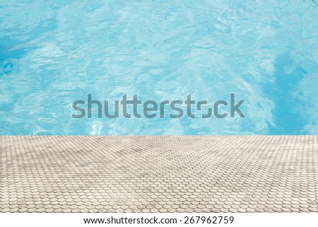 paving brick floor with blue shine water background