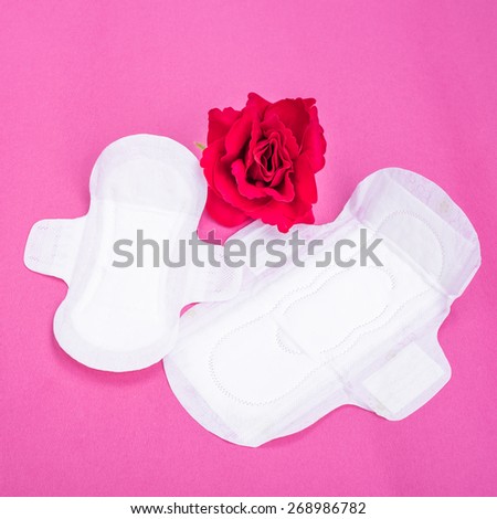 Woman hygiene protection (sanitary) on paper background