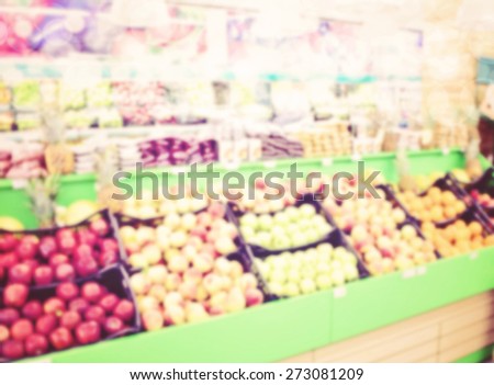 Shelf with fruits on a farm market, trademarks blurred or removed, toned image