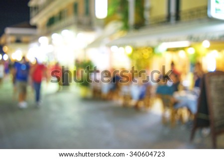 abstract blurred restaurant or coffee shop on shopping street background with lighting filter