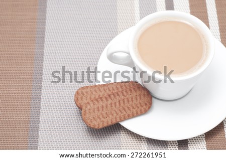Hot drink and cookies (actually tea and biscuits, but it could be any hot drink). High-key studio shot
