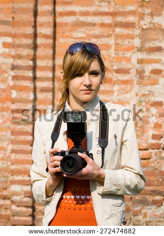 Scene with copyspace of Digital Photographer with Digital Camera.