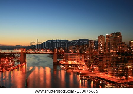 Burrard bridge and the city of Vancouver at night. Canada.