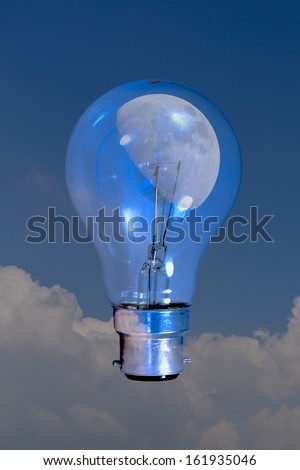 Beautiful moon viewed through lightbulb symbolising the vastness of the universe against mankind\'s futility