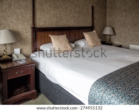 Worn and faded traditional English Hotel Room