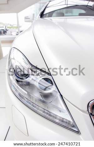 White car is a white, bright showroom.