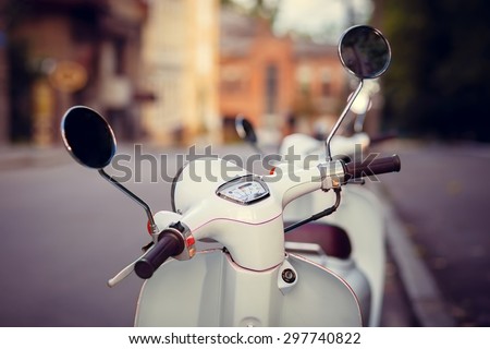 Scooter stands on the old street