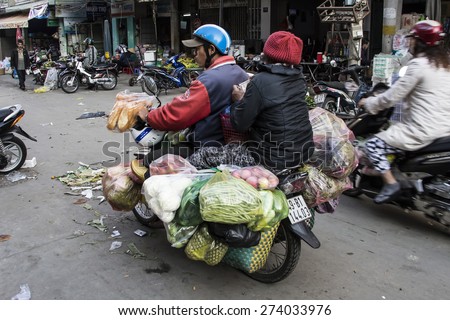 DA LAT CITY, VIETNAM - April 15, 2015: Fruits And vegetable Overloaded Motorcycle Dalat city Vietnam