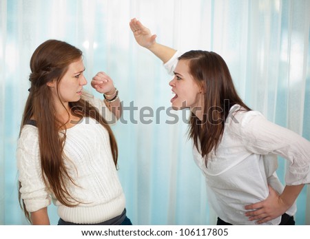 Sisters having an argument and getting physical with a fight.