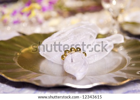 Soft romantic table settings for a wedding, suitable for background of a menu, invitation or wedding brochure/magazine. Shallow DOF.
