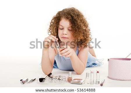 stock photo : A gorgeous little girl with curly hair in the studio, 