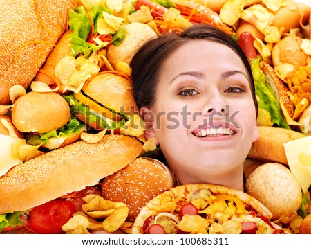 Thin woman holding hamburger.