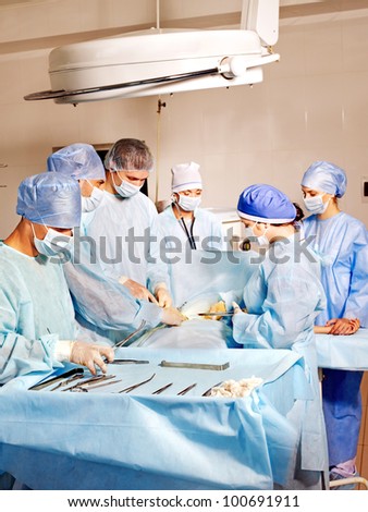 Sick patient on gurney in operating room.