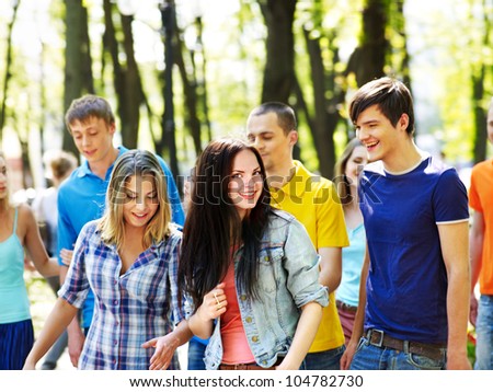 Group happy people in summer outdoor.