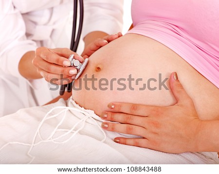 Pregnant woman with doctor . Isolated.