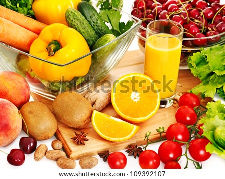 Fresh vegetable and fruit and glass of juice.