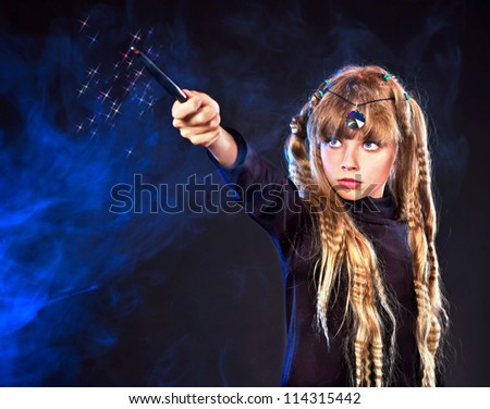 Girl  holding magic wand casting spells.