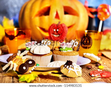 Halloween table with trick or treat and drink.