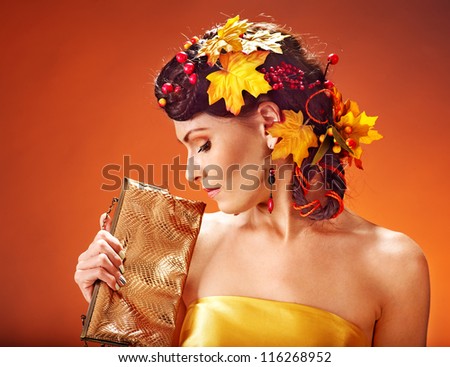 Woman with  autumn hairstyle and make up.