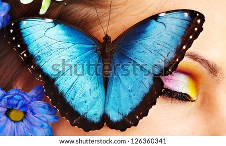 Woman with  flower and  butterfly. Isolated.
